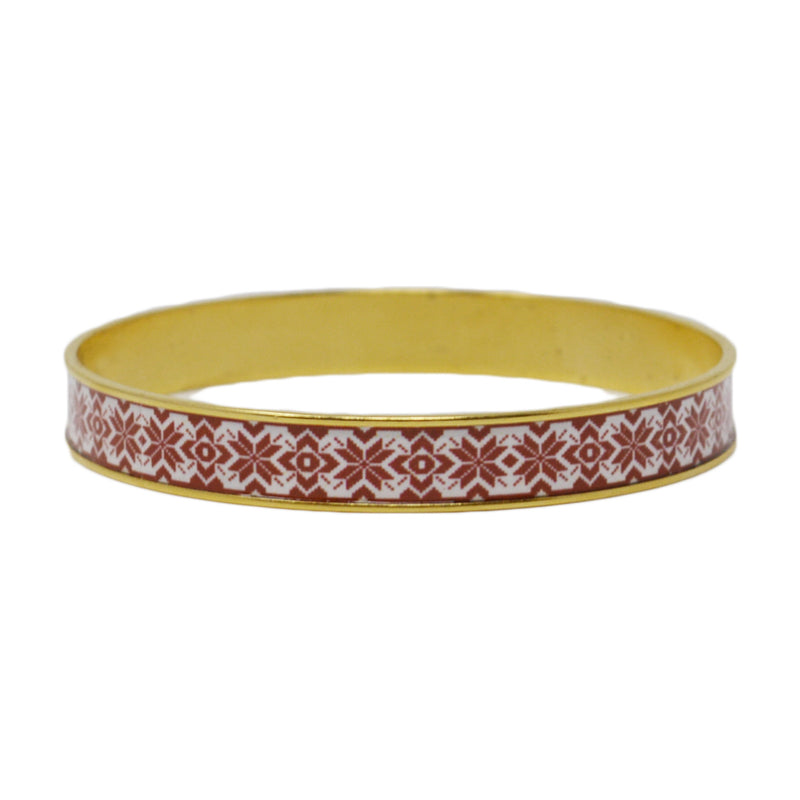 This beautiful patterned bangle is filled with one a fair isle pattern set in your choice of antiqued 24k gold or .999 fine silver plated brass.