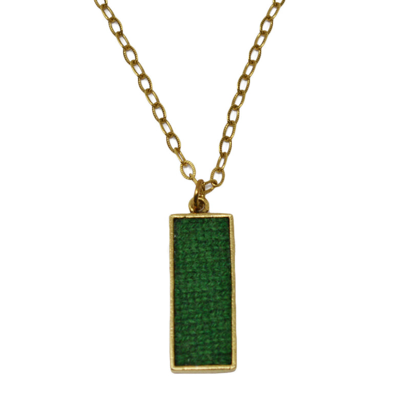 This beautiful necklace is filled with soft, rich green cashmere set inside an antiqued 24k gold plated pewter pendant on an antiqued 24k gold plated brass chain.